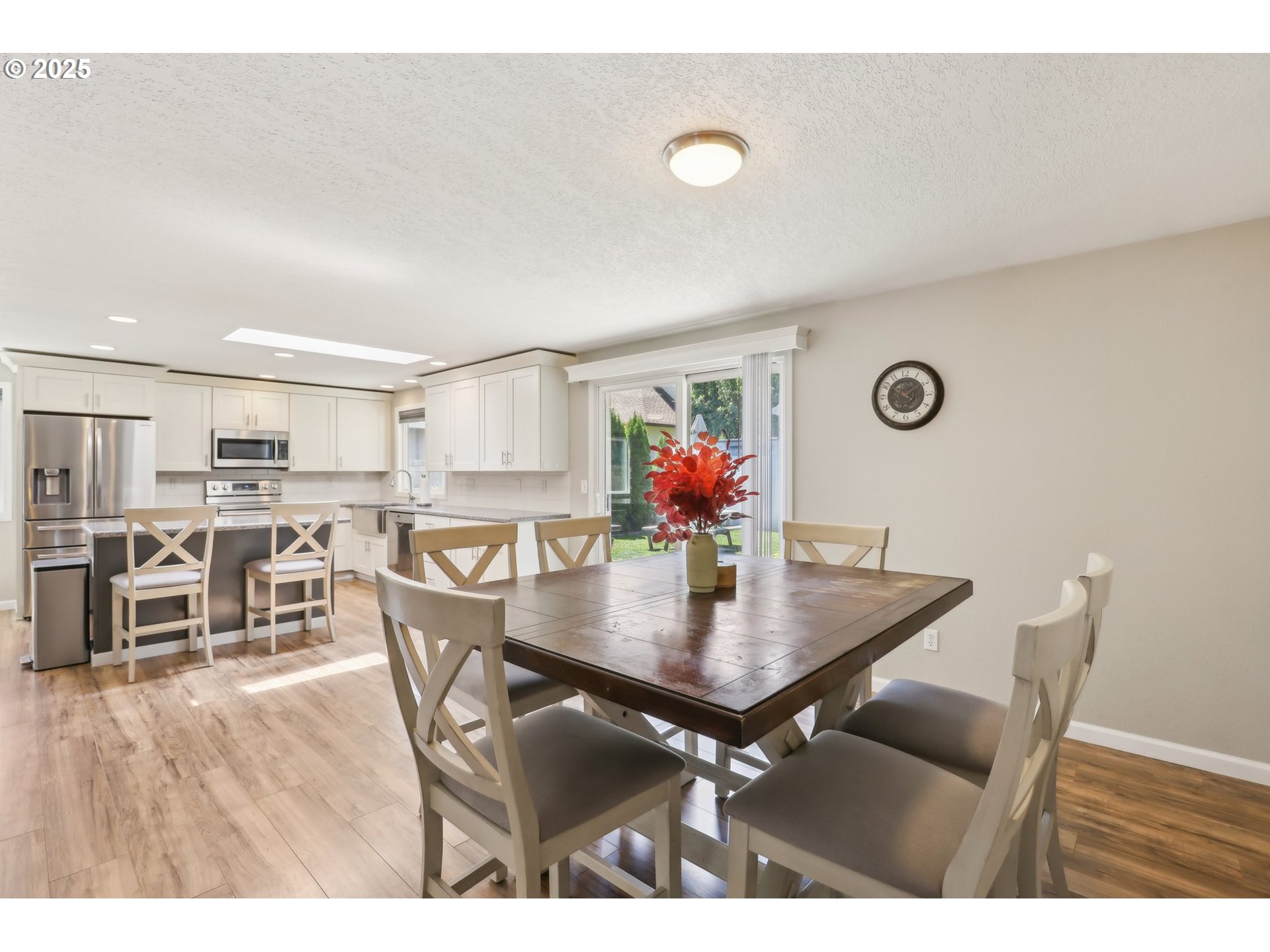 29495 Southwest Yosemite Street Wilsonville, OR 97070 - Photo 12 of 40 a view of a dining room with furniture and wooden floor