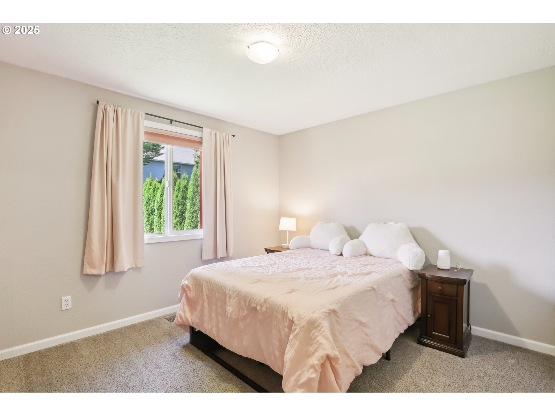 29495 Southwest Yosemite Street Wilsonville, OR 97070 - Photo 23 of 40 a bedroom with a bed and a window