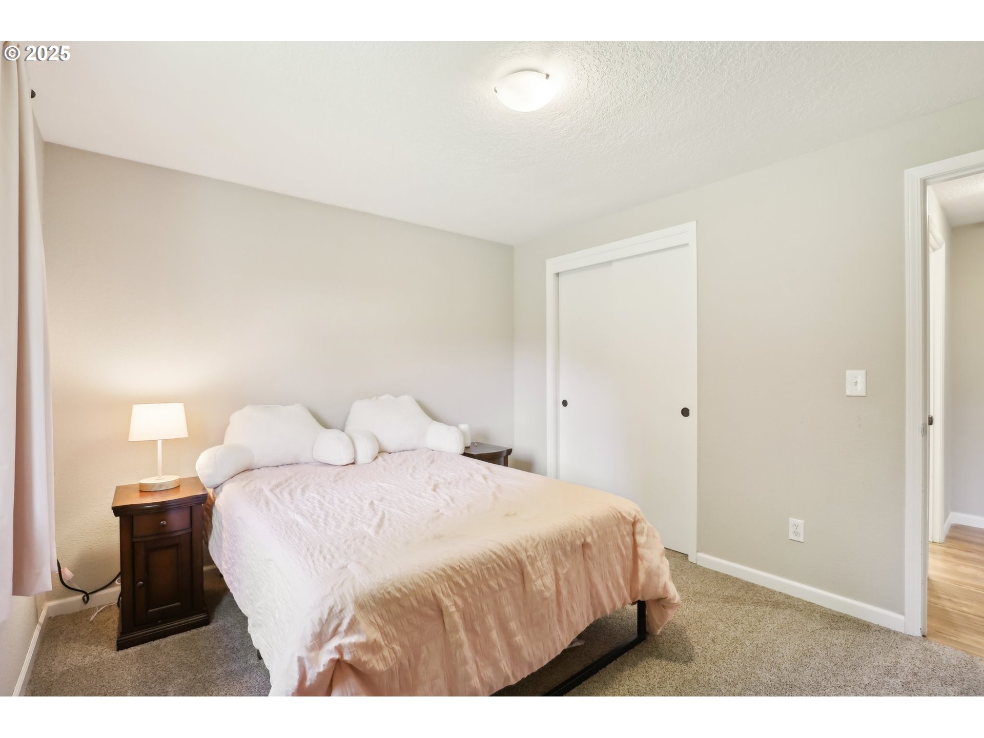 29495 Southwest Yosemite Street Wilsonville, OR 97070 - Photo 24 of 40 a bedroom with a bed and a painting