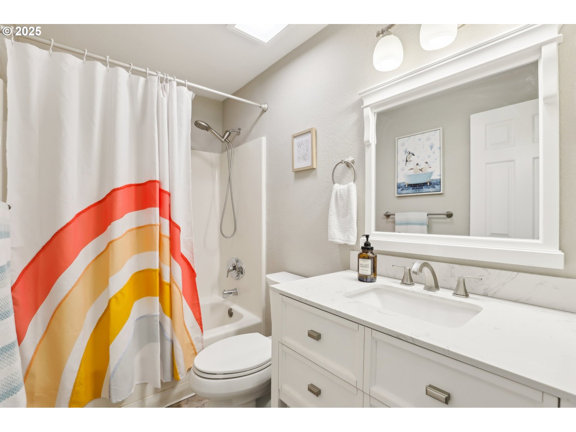 29495 Southwest Yosemite Street Wilsonville, OR 97070 - Photo 25 of 40 a bathroom with a sink a toilet and a mirror
