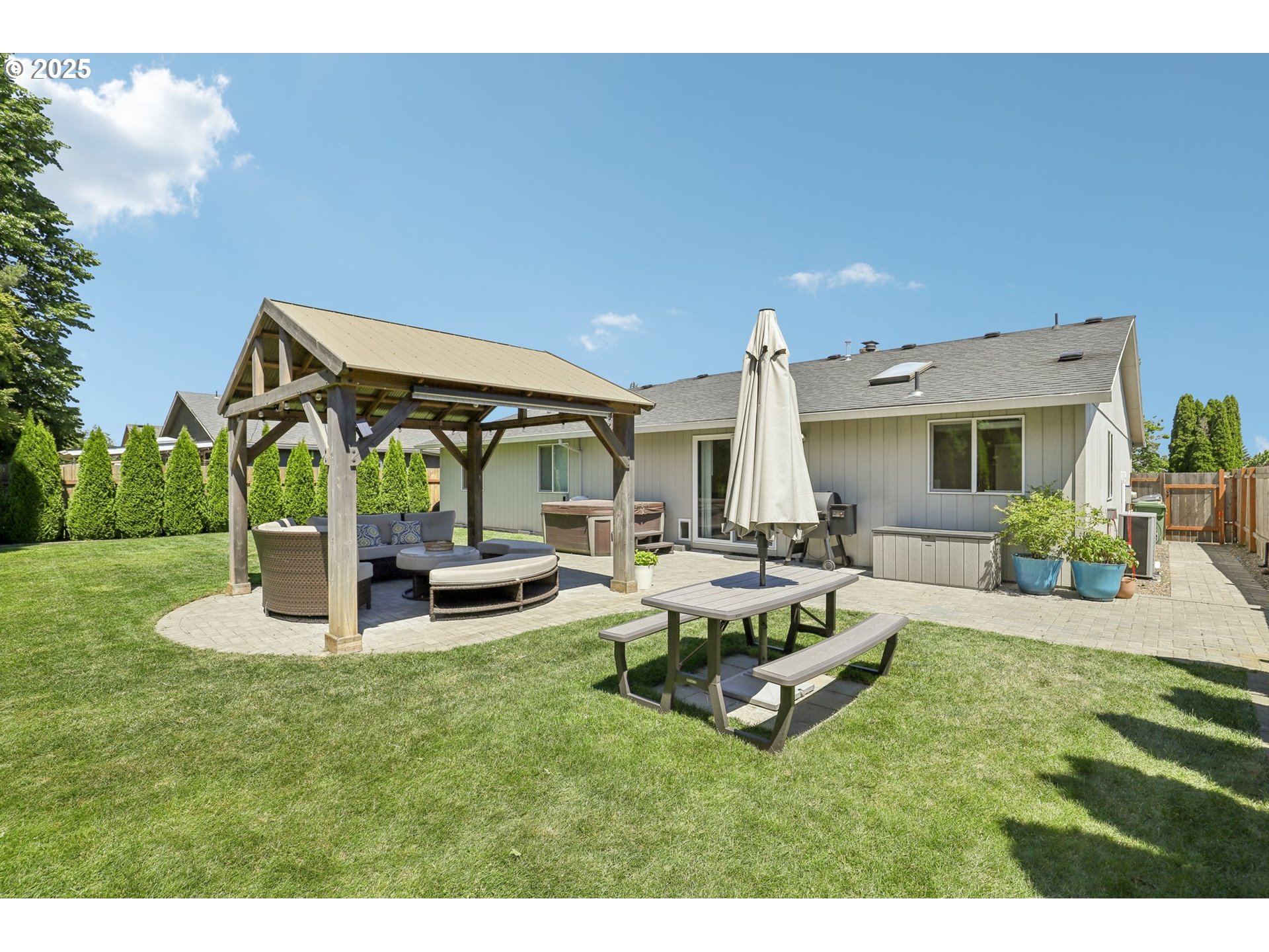 29495 Southwest Yosemite Street Wilsonville, OR 97070 - Photo 32 of 40 a view of a house with backyard porch and sitting area