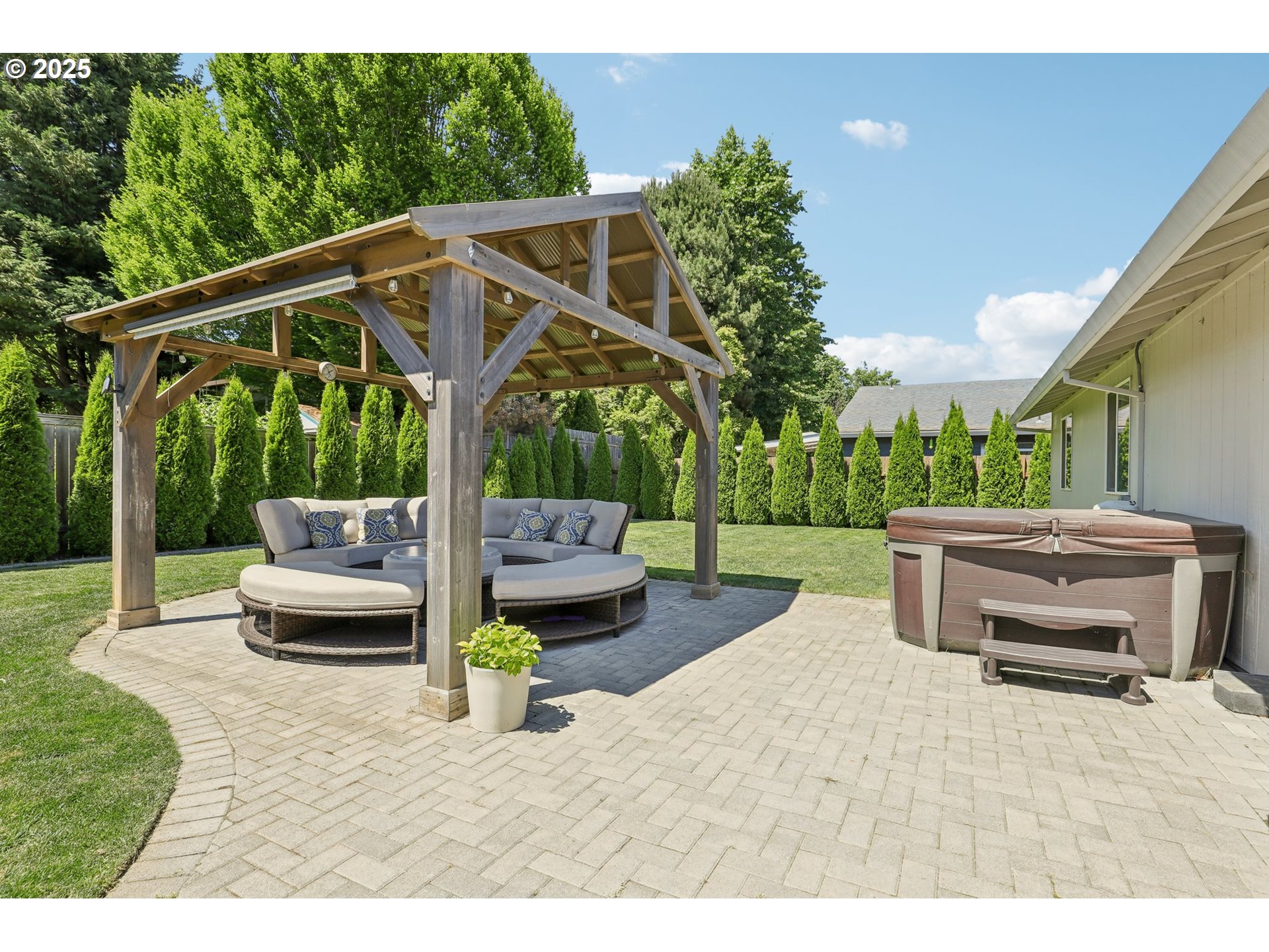 29495 Southwest Yosemite Street Wilsonville, OR 97070 - Photo 36 of 40 a backyard of a house with fountain table and chairs
