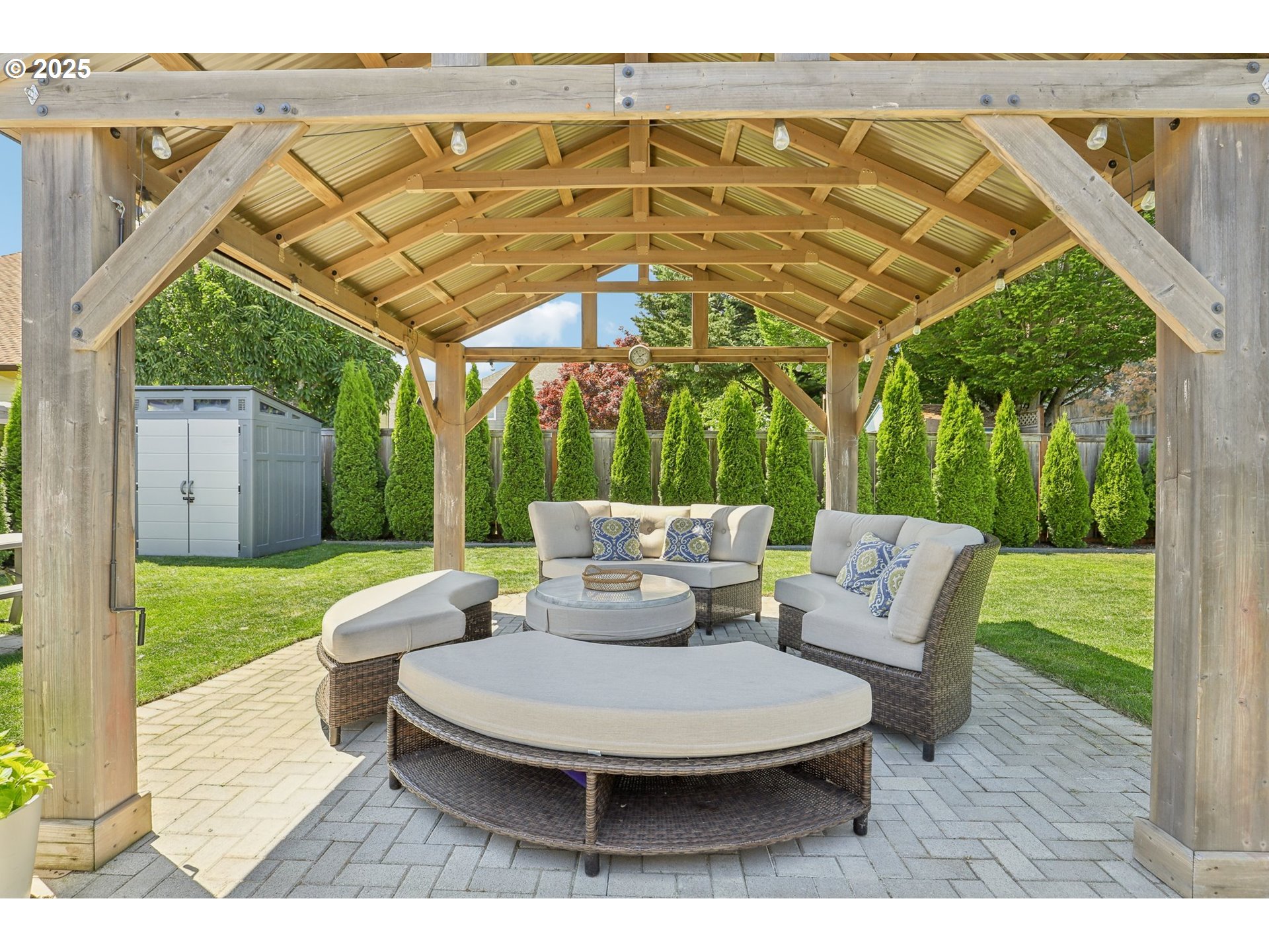 29495 Southwest Yosemite Street Wilsonville, OR 97070 - Photo 37 of 40 a view of a patio with a table chairs and a backyard