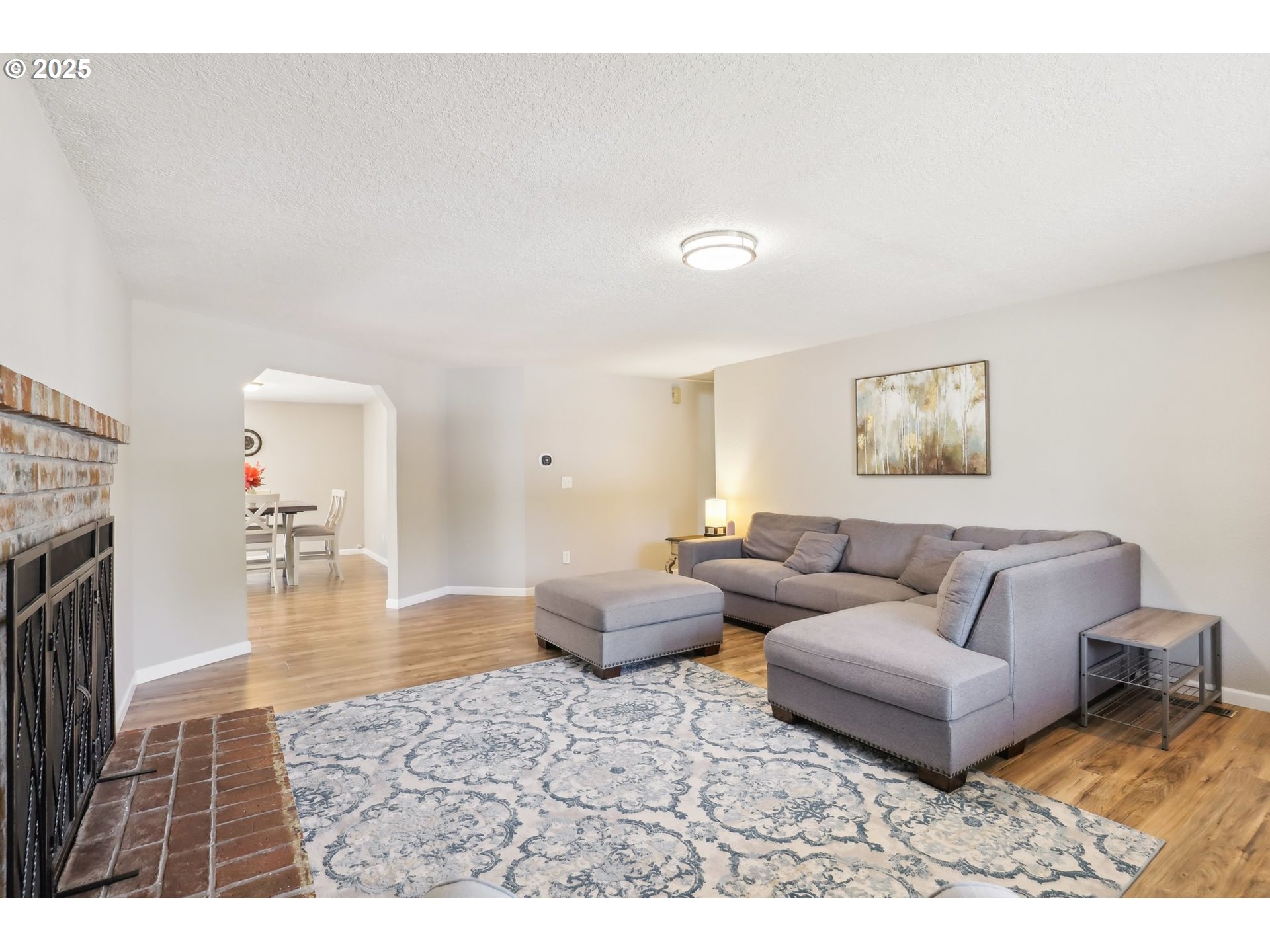29495 Southwest Yosemite Street Wilsonville, OR 97070 - Photo 5 of 40 a living room with furniture and a wooden floor