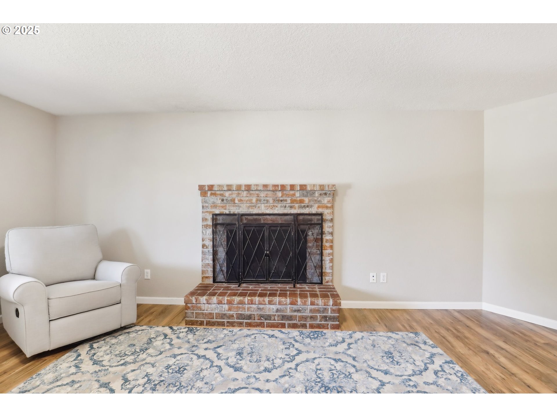 29495 Southwest Yosemite Street Wilsonville, OR 97070 - Photo 7 of 40 a living room with furniture and a fireplace