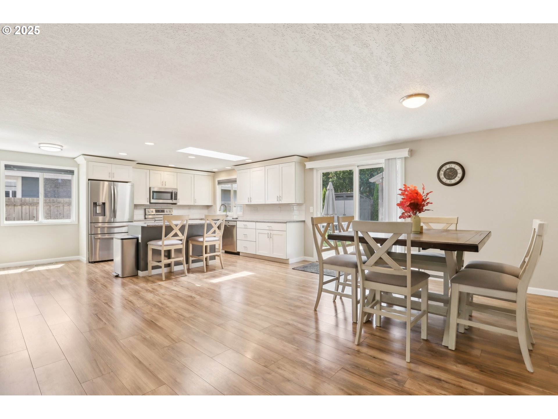 29495 Southwest Yosemite Street Wilsonville, OR 97070 - Photo 9 of 40 a dining room with furniture and wooden floor