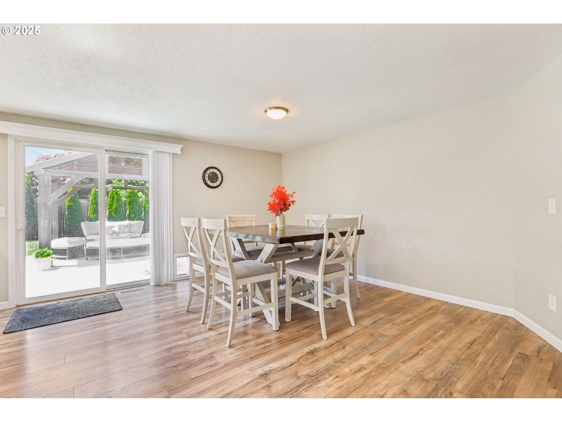 29495 Southwest Yosemite Street Wilsonville, OR 97070 - Photo 10 of 40 a dining room with furniture and wooden floor