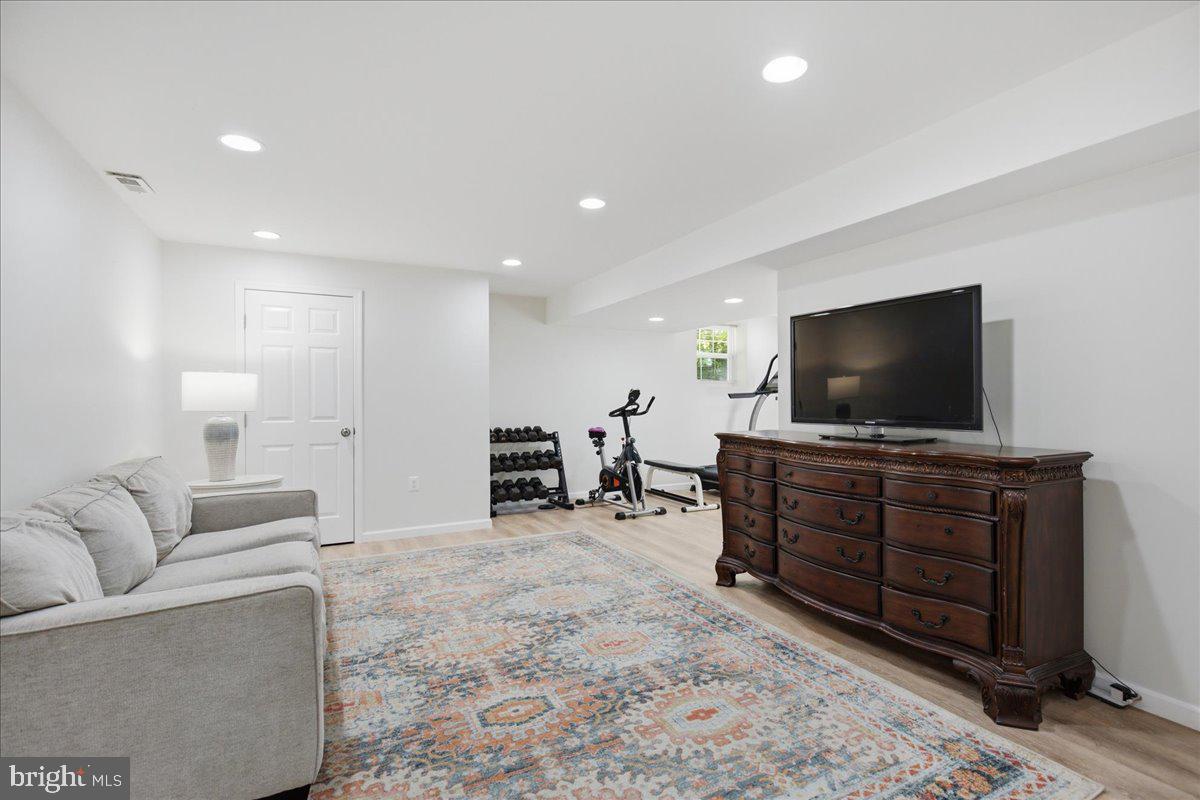 2424 Springbrook Court Huntingtown, MD 20639 - Photo 82 of 103 a living room with furniture and a flat screen tv