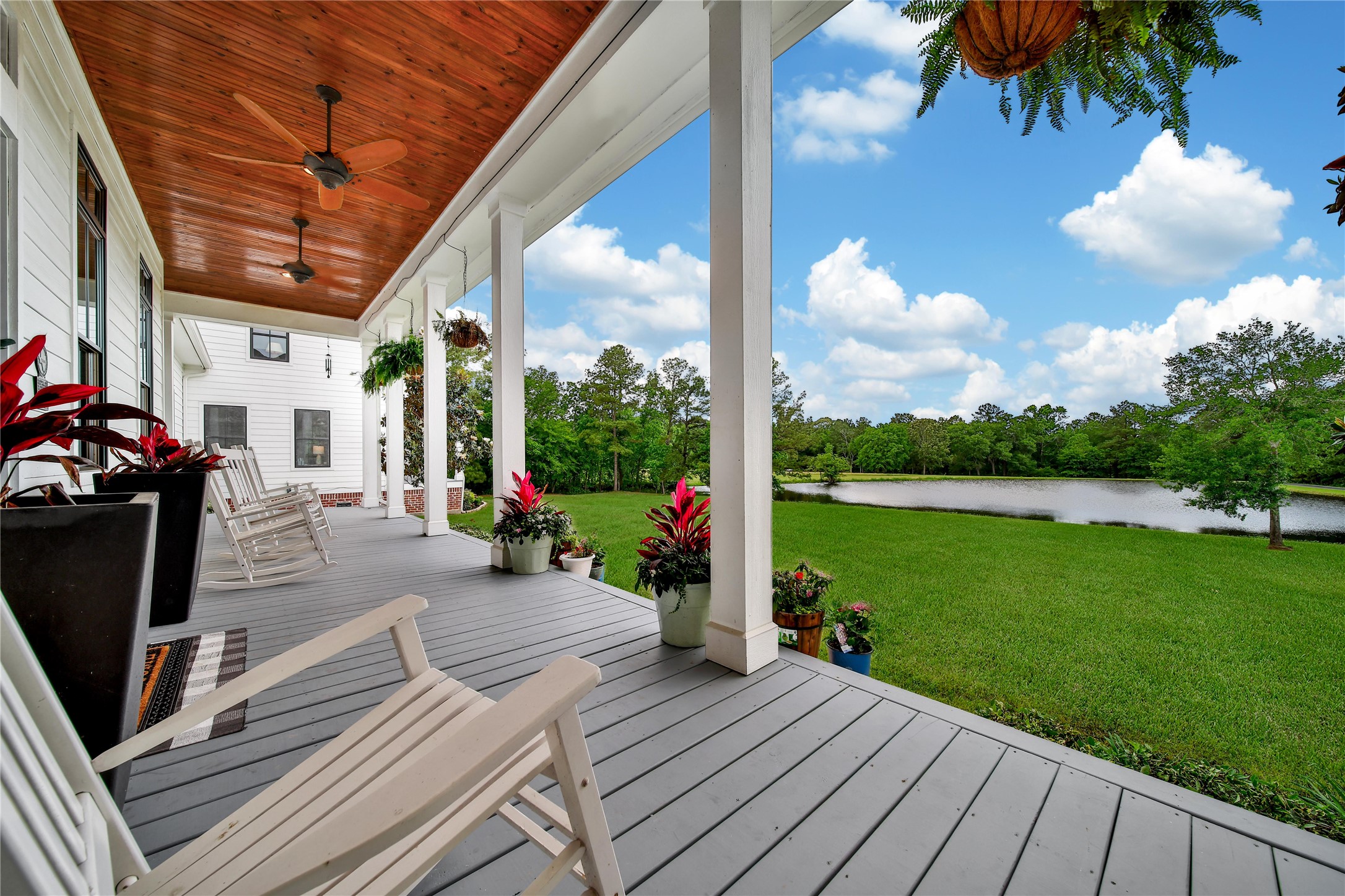 18875 Rabon Chapel Road Montgomery, TX 77316 - Photo 4 of 45 a view of a porch with wooden floor and outdoor seating