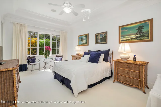 a view of swimming pool with a table and chairs