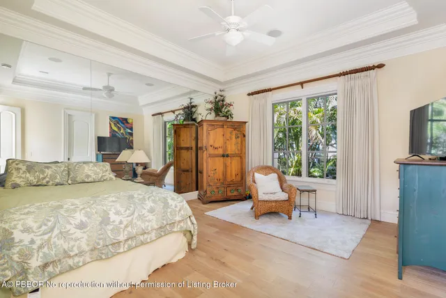 a view of a house with a yard potted plants