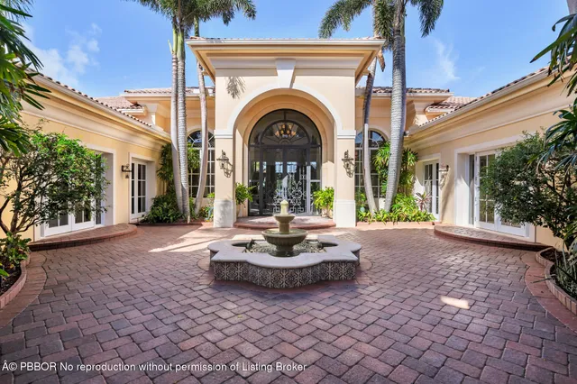 a view of a living room and floor to ceiling window or kitchen