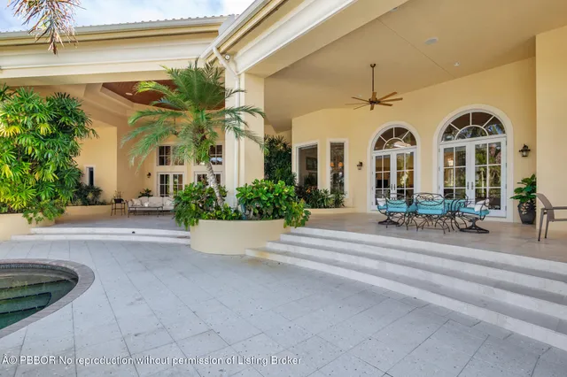 a view of a house with a fountain