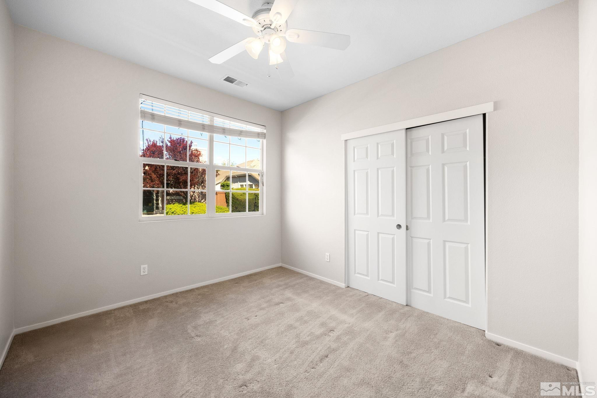9653 Truckee Meadows Place Reno, NV 89521 - Photo 12 of 22 a view of an empty room with a window
