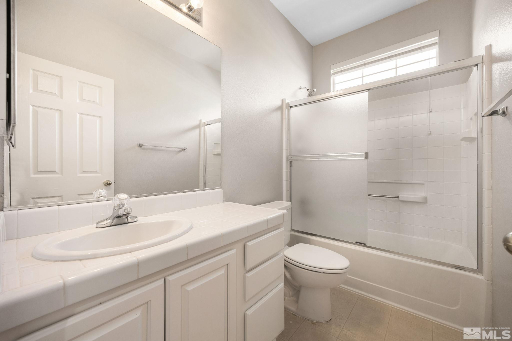 9653 Truckee Meadows Place Reno, NV 89521 - Photo 13 of 22 a bathroom with a sink toilet and shower