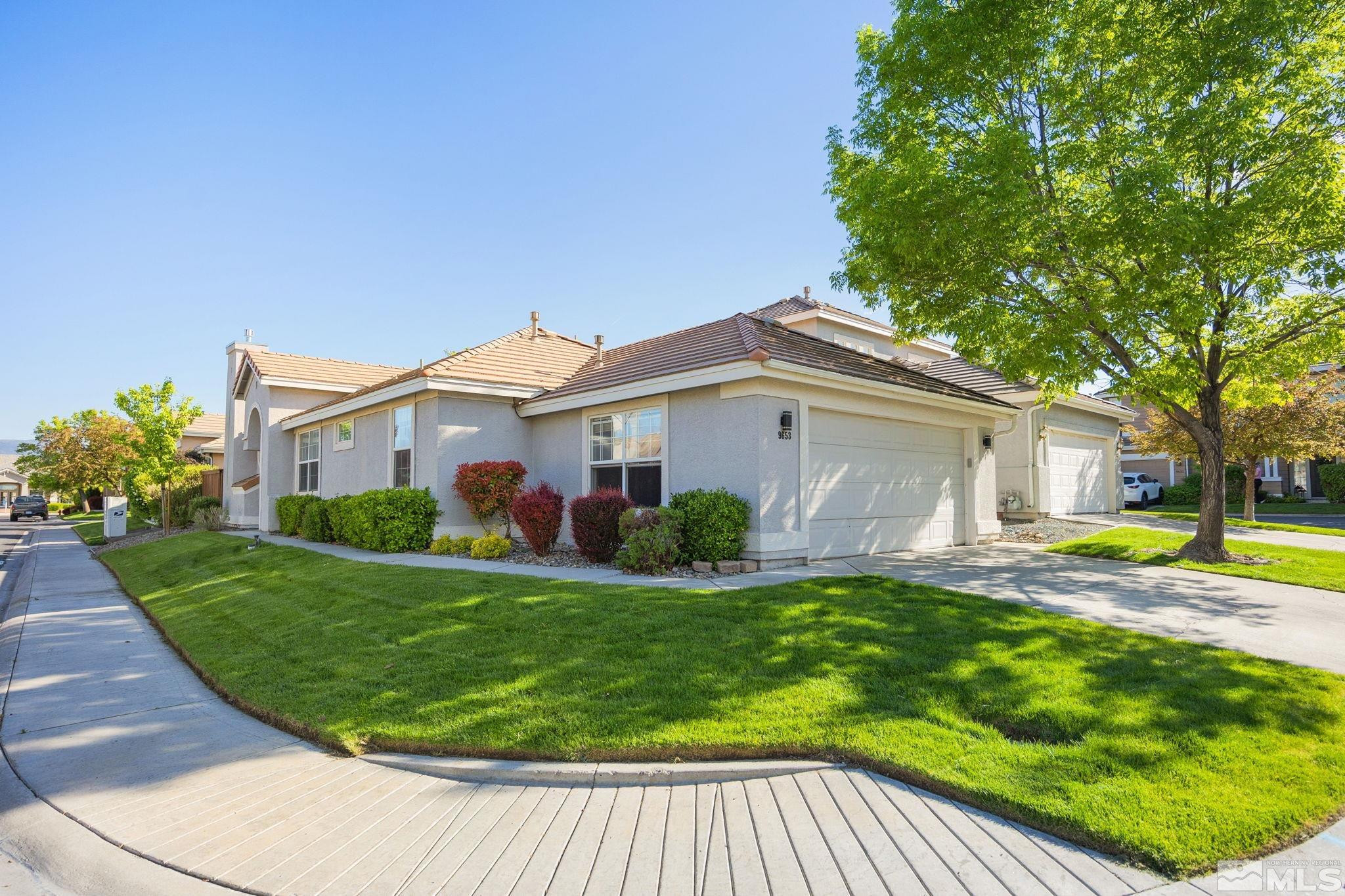 9653 Truckee Meadows Place Reno, NV 89521 - Photo 18 of 22 a view of a house with a swimming pool and a yard