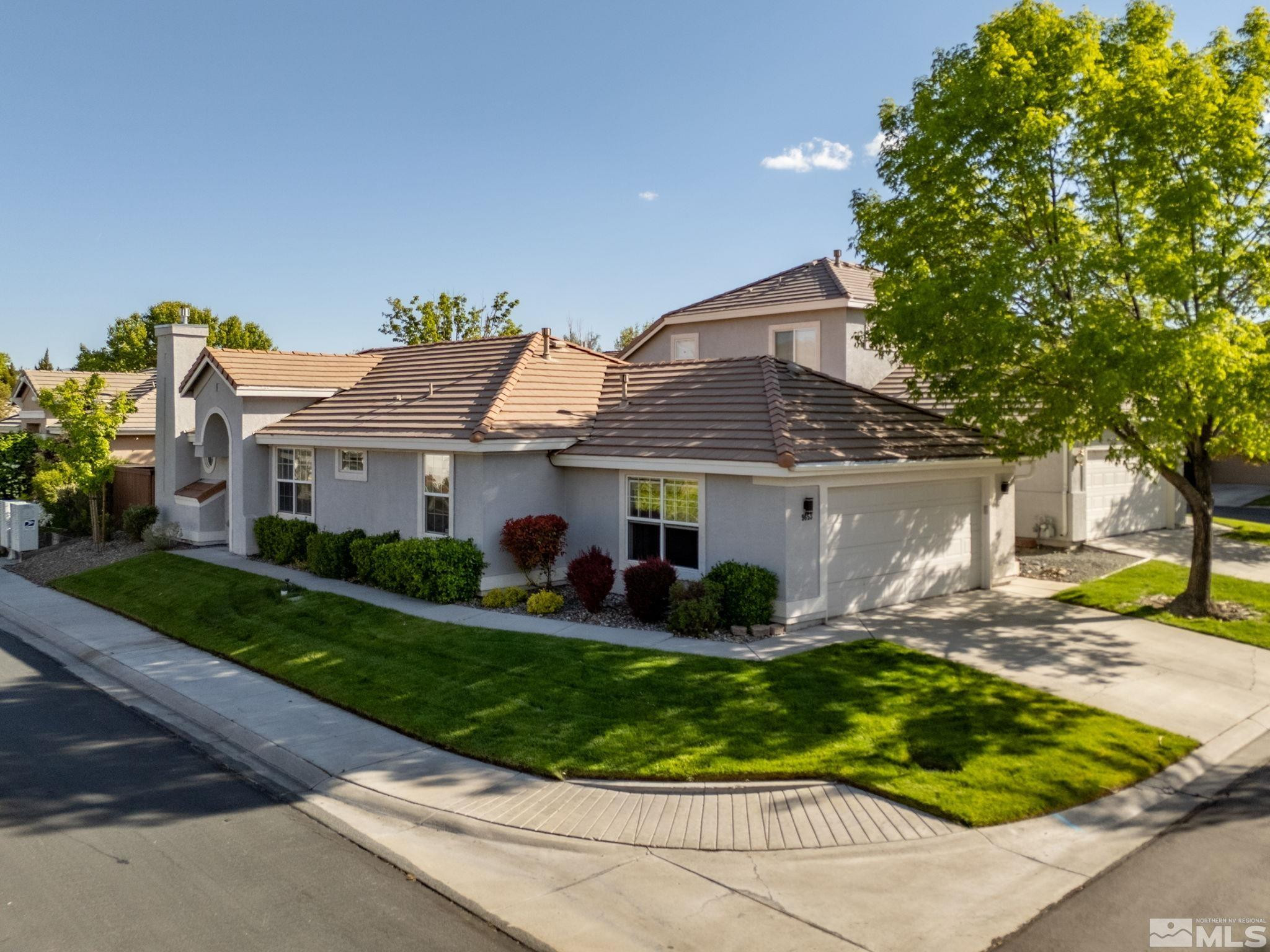 9653 Truckee Meadows Place Reno, NV 89521 - Photo 2 of 22 front view of a house with a yard