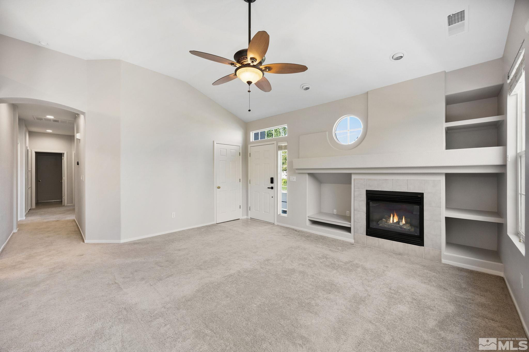 9653 Truckee Meadows Place Reno, NV 89521 - Photo 6 of 22 a view of an empty room with a fireplace