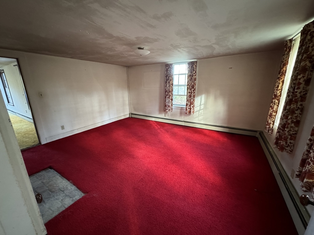 56 Barre Road Oakham, MA 01068 - Photo 17 of 36 a view of empty room with windows