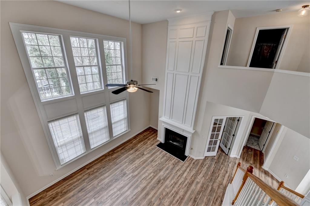100 Hawnley Trc Northwest Suwanee, GA 30024 - Photo 35 of 58 a view of a livingroom with wooden floor and a window