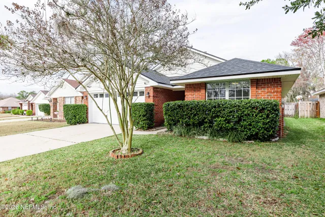 front view of a house with a yard