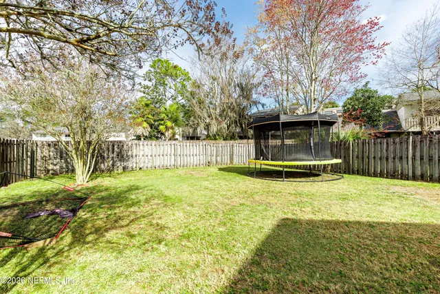 a view of backyard with green space