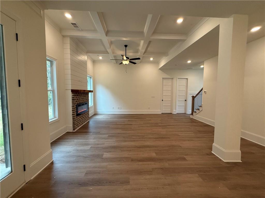 3229 Traditions Way Jefferson, GA 30549 - Photo 12 of 43 an empty room with wooden floor and a ceiling fan