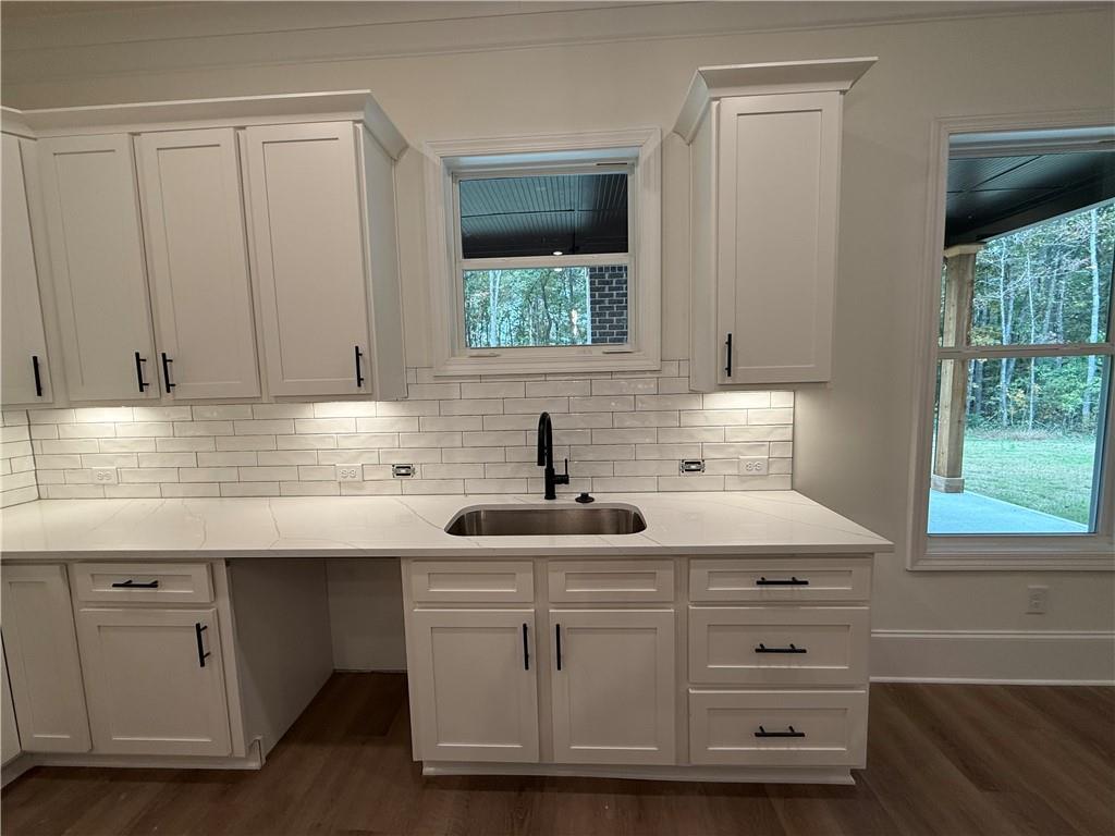 3229 Traditions Way Jefferson, GA 30549 - Photo 15 of 43 a kitchen with white cabinets and window