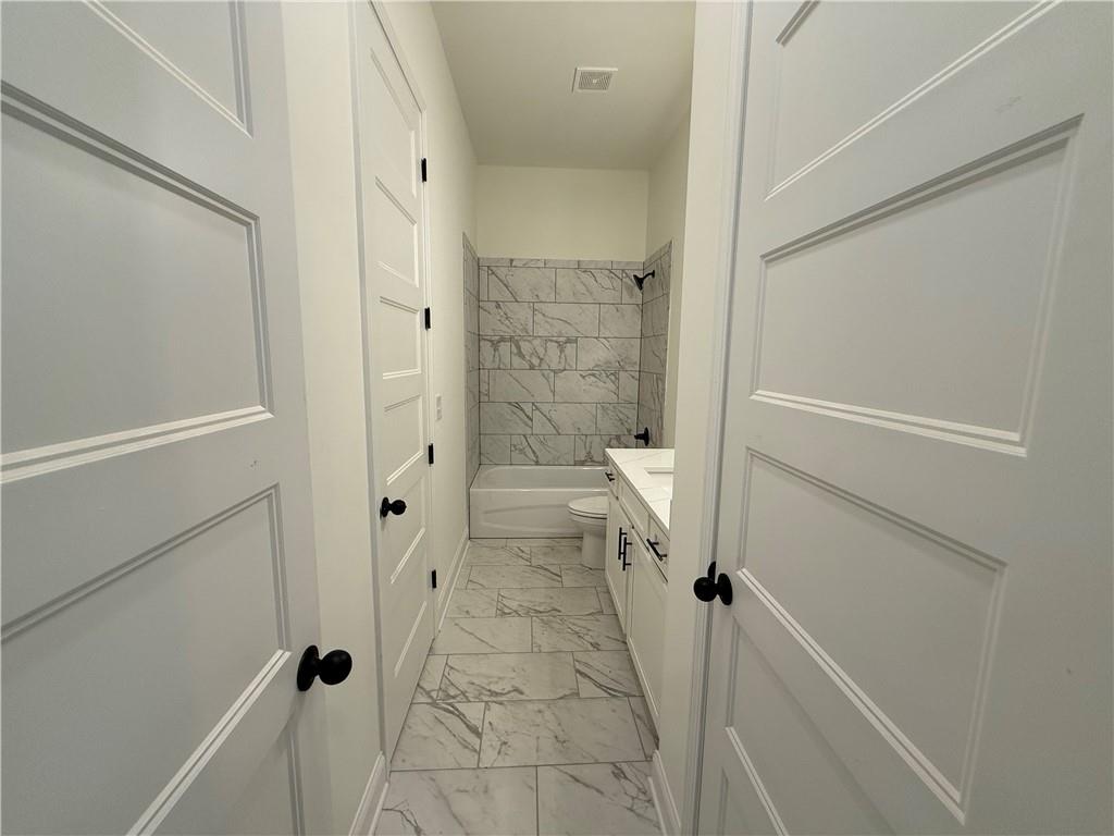 3229 Traditions Way Jefferson, GA 30549 - Photo 18 of 43 a bathroom with a granite countertop shower