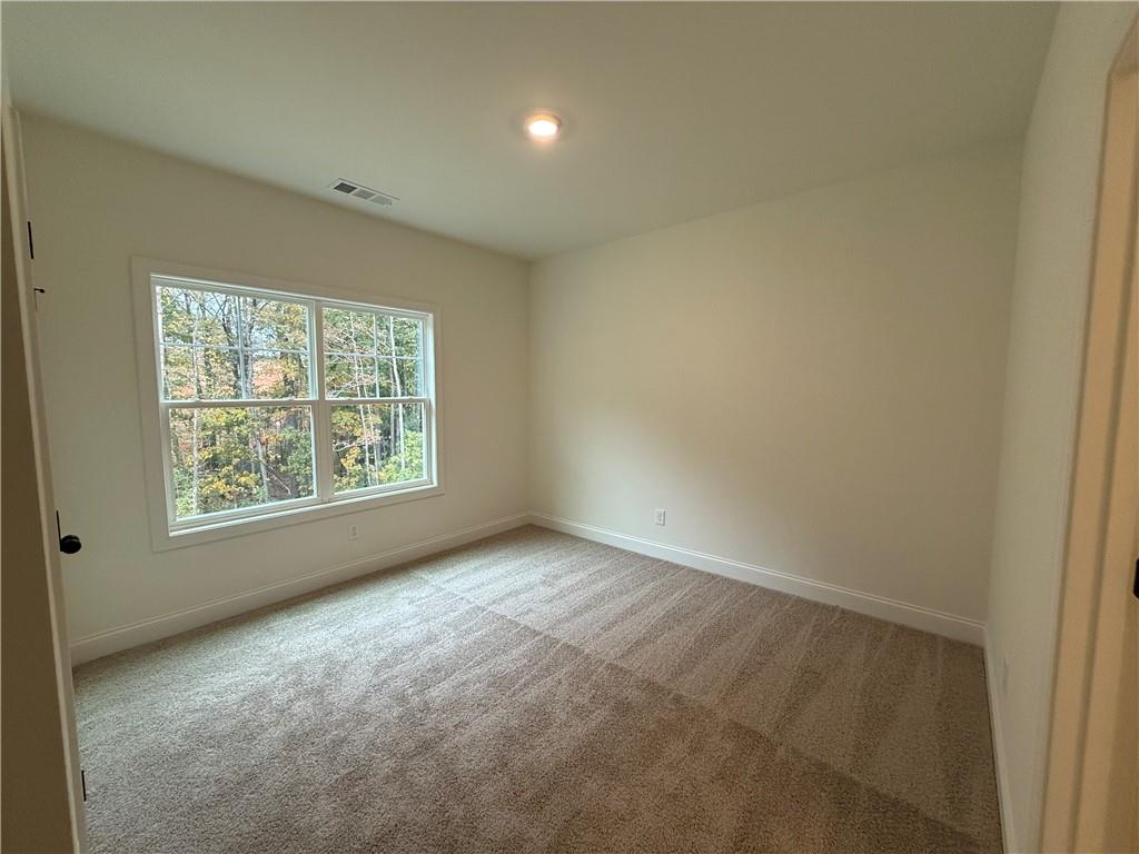 3229 Traditions Way Jefferson, GA 30549 - Photo 32 of 43 an empty room with windows