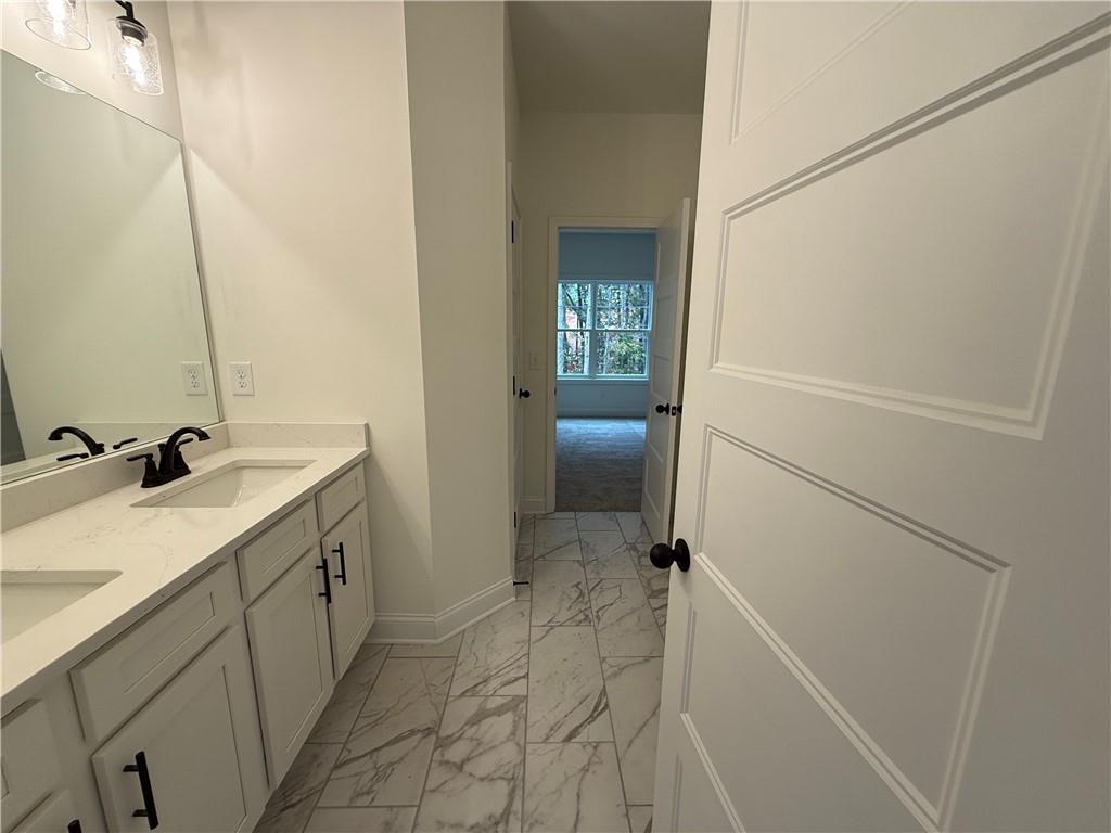3229 Traditions Way Jefferson, GA 30549 - Photo 35 of 43 a bathroom with a sink and mirror