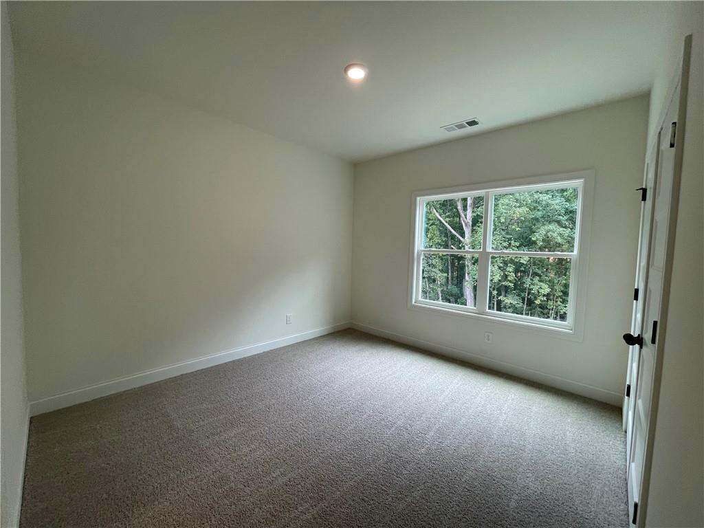 3229 Traditions Way Jefferson, GA 30549 - Photo 37 of 43 an empty room with windows