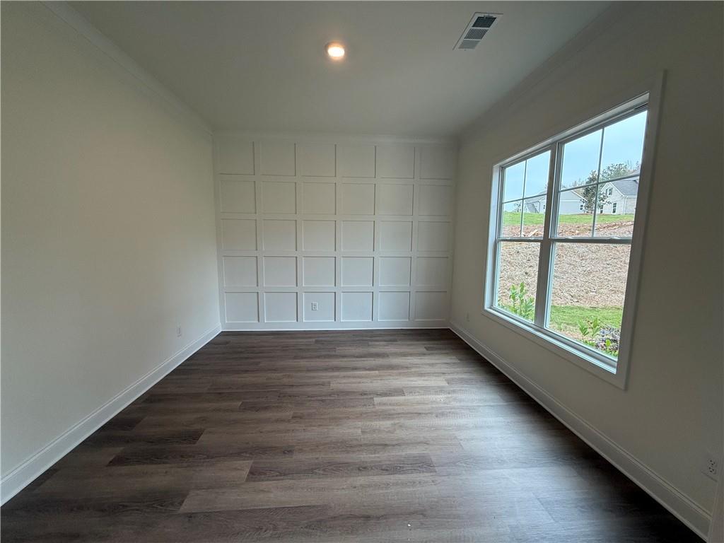 3229 Traditions Way Jefferson, GA 30549 - Photo 6 of 43 an empty room with wooden floor and windows