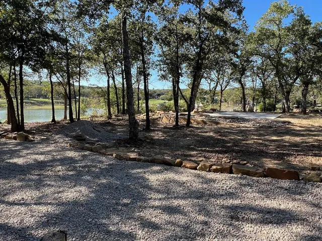 a view of a backyard of the house