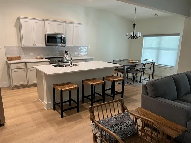 a view of a kitchen from the hallway