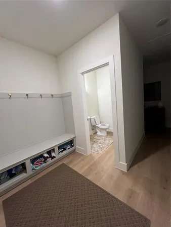 a bathroom with a sink toilet and a mirror