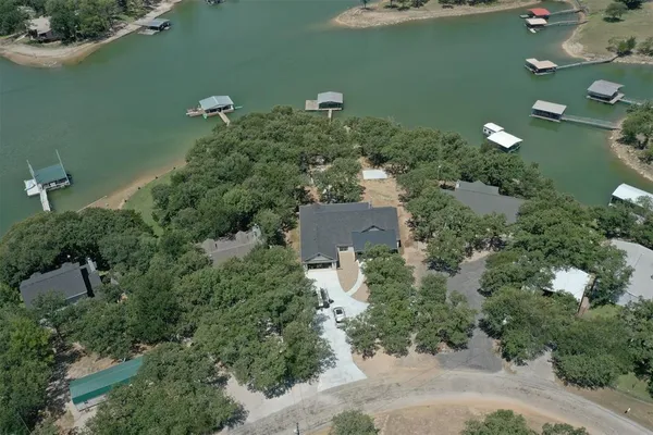 an aerial view of a houses with city view