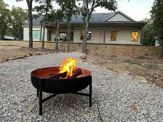 a view of a park with large trees