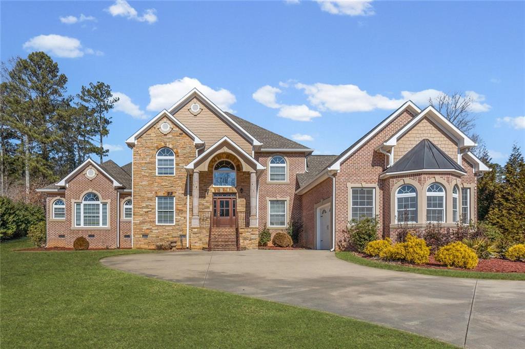a front view of a house with garden