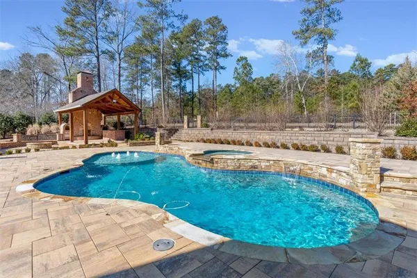 a view of a swimming pool with a lounge chairs