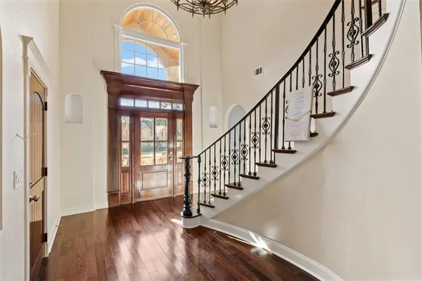 a view of front door with staircase