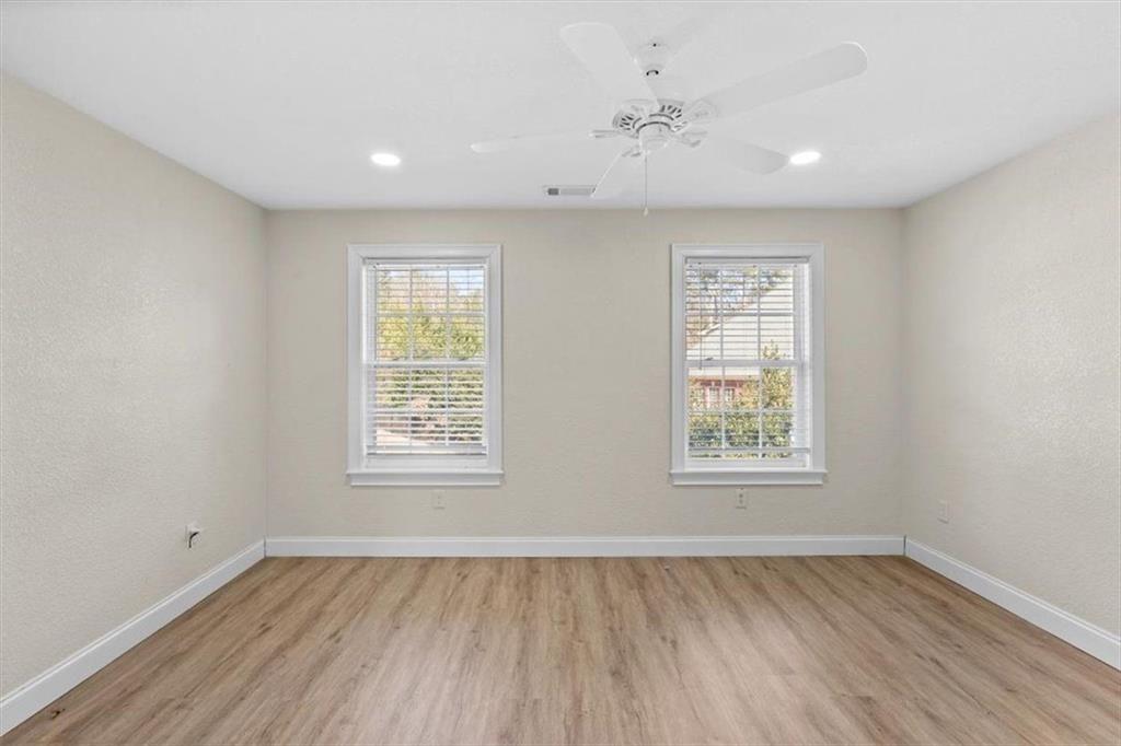 142 Nelson Boulevard Northwest Rome, GA 30165 - Photo 47 of 81 a view of an empty room with wooden floor and a window