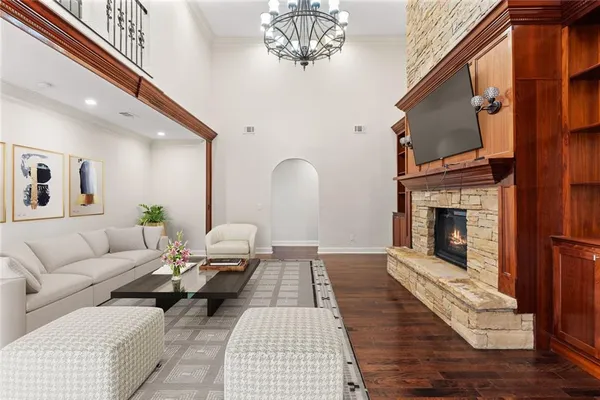 a view of a livingroom with a fireplace and cabinet