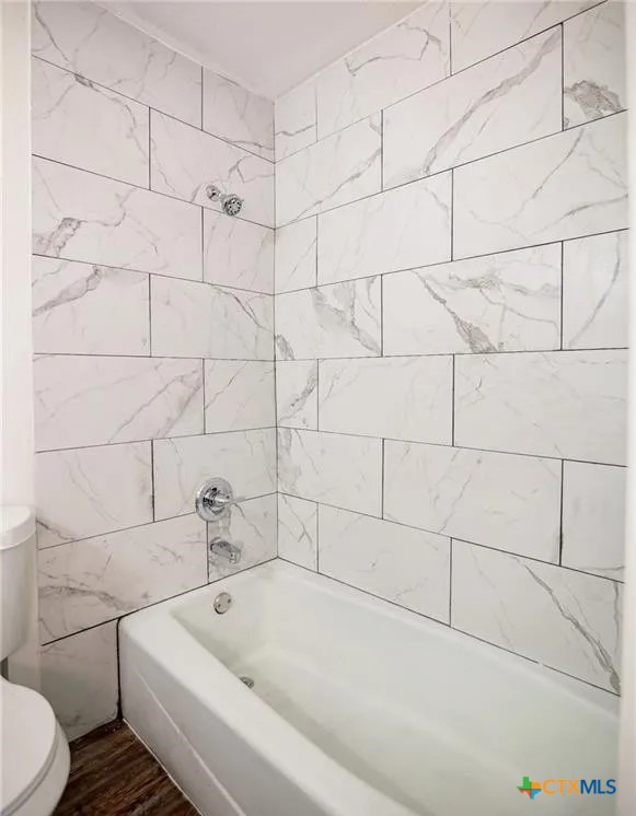 2003 Woodlawn Street Victoria, TX 77901 - Photo 15 of 35 a bathroom with a bathtub and toilet