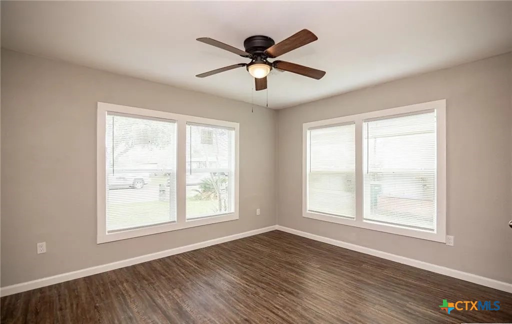 2003 Woodlawn Street Victoria, TX 77901 - Photo 17 of 35 a view of an empty room with wooden floor and a window
