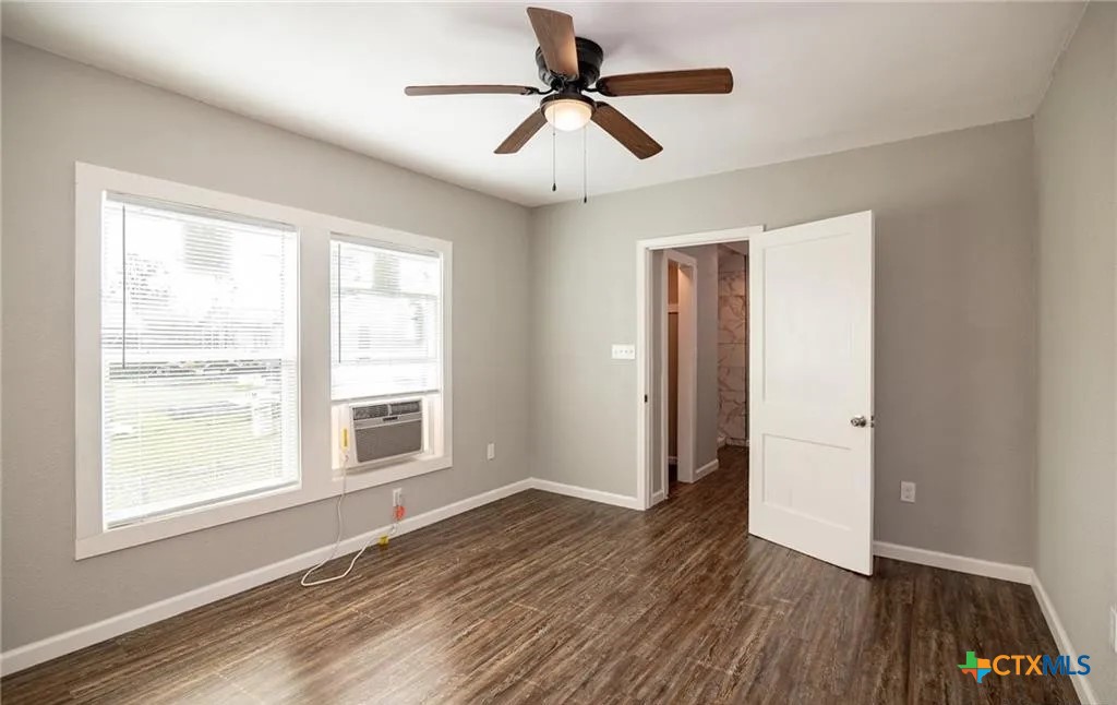 2003 Woodlawn Street Victoria, TX 77901 - Photo 28 of 35 a view of an empty room with window and wooden floor
