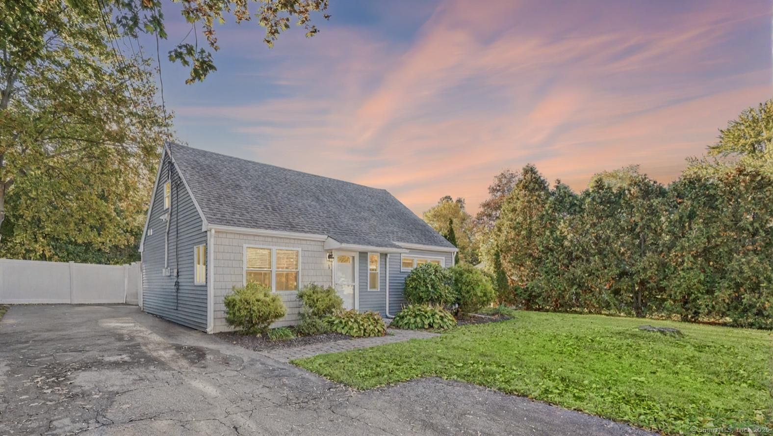 1 George Lane Wallingford, CT 06492 - Photo 1 of 1 a front view of a house with a garden