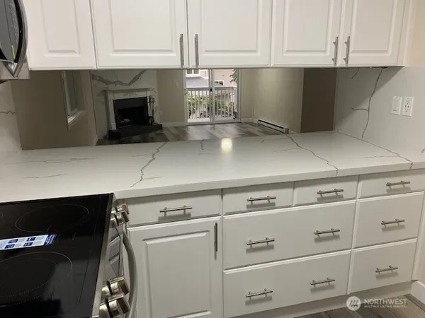 a kitchen with appliances cabinets and a counter top