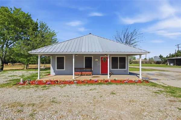 a front view of a house with porch