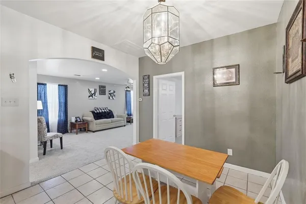 a bedroom with furniture and a chandelier